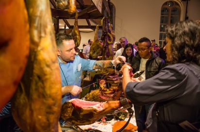 Rodrigo Duarte from Caseiro e Bom Gourmet House in Newark, N.J., slicing and serving cured ham.