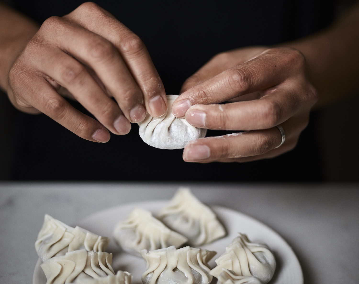 Chef Thomas Chen from Tuome makes dumplings at his home in Flushing.