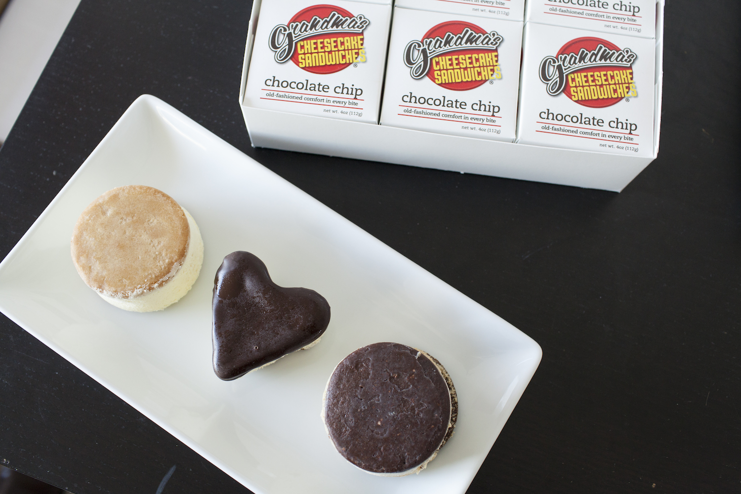 Plain, heart-shaped chocolate dipped and milk chocolate cheesecakes from Grandma’s Cheesecake Sandwiches.