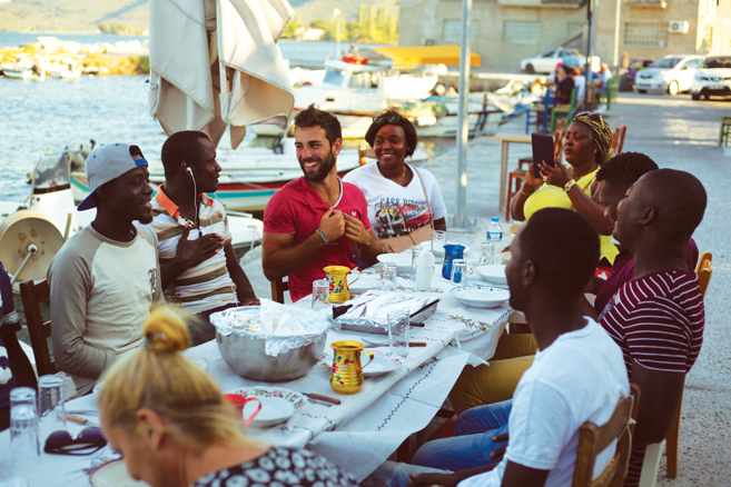 Immigrants dining together in Lesbos, Greece.