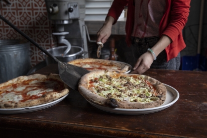 Carving out slices at Houdini Kitchen Laboratory in Flushing, Queens, New York.