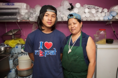 Gyan K. Thapa of Hamro Bhim's Cafe in Jackson Heights with her son.