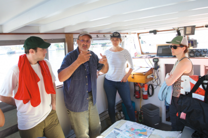 Riverkeeper's Captain John Lipscomb takes a group of guests from the environmentally-conscious clothing manufacturer, Patagonia, on a tour of Newtown Creek.