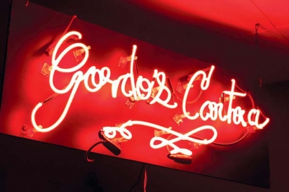 Gordo’s neon sign gives a red glow.