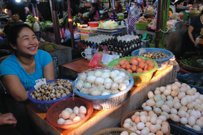 Quail, duck, chicken? The Egg Lady's got'em for you at the local farmers market in Hanoi, Vietnam.