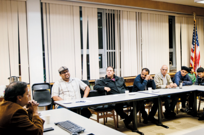 A discussion at a True Islam meeting at the Ahmadiyya Muslim Community Center.