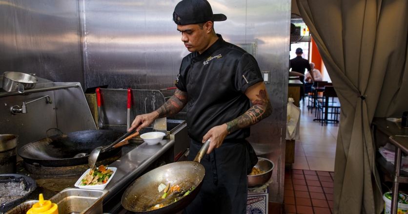 Co-owner John Htin’s family staffs the kitchen at Asia Bowl in Forest Hills, Queens.
