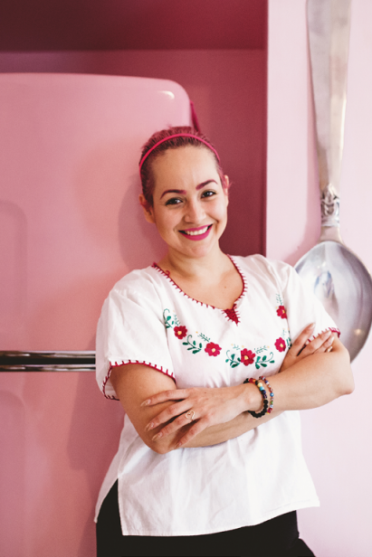 Angie Vargas of League of Kitchens in her bright and colorful kitchen.