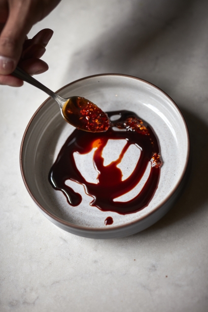 Chef Thomas Chen spices up his chili sauce with a good dousing of hot oil balanced by a sweet soy sauce.