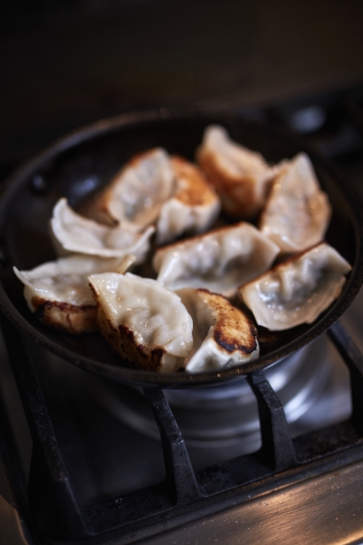 Dumplings getting fried at Chef Thomas Chen's house in Flushing.