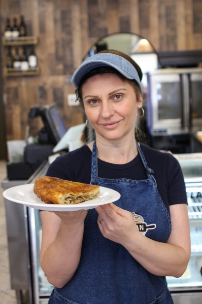 Sabina Smailovic, the manager at Djerdan, in Astoria, with a savory meat-filled burek.