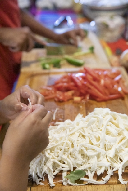 Oaxaca cheese for the tamales is hand-shredded.