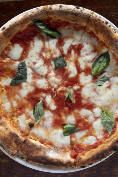 Houdini Kitchen Laboratory’s Margherita pizza fresh from the oven in Ridgewood, Queens, New York.