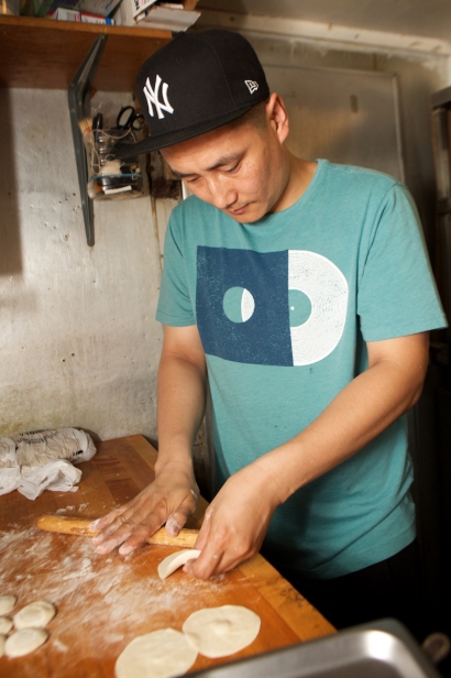 Lobsang Choephel, chef and co-owner of Little Tibet in Jackson Heights, making more momos.