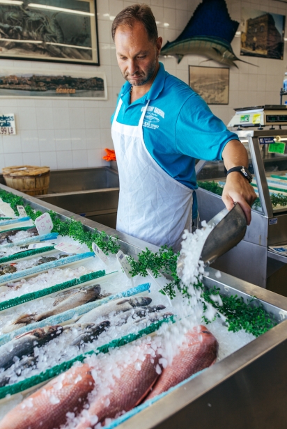 Vinnie Marinelli icing fish at Crossbay Fish Market in Queens