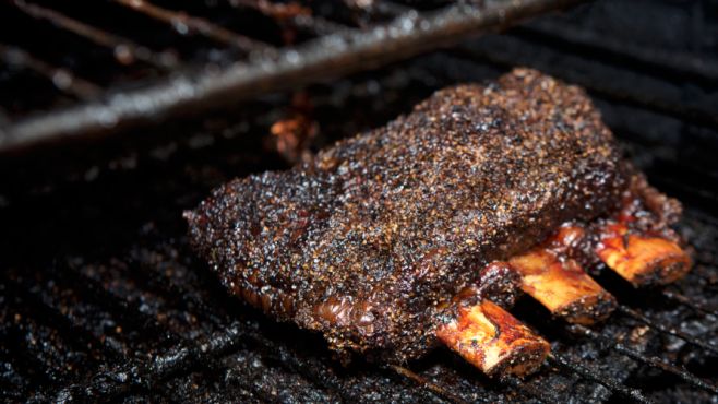 Beef ribs in the smoker at Salt & Bone in Astoria.